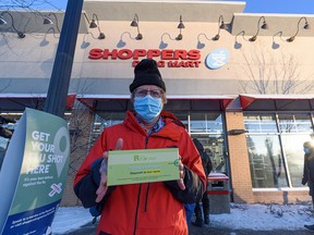 Steve Mole with his COVID-19 antigen test kit that he picked up at the Shoppers Drug Mart in Kensington after a lengthy wait in line on Friday, Dec. 17, 2021.