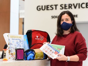 Alexandra Velosa, Southcentre Mall marketing manager, poses for a photo with some of the goods included in the backpacks that are filled with resources for kids with sensory disabilities at the shopping centre on Wednesday, January 19, 2022. The backpacks are available for rent at the guest services at the Mall.
