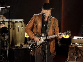 FILE PHOTO: Singer/songwriter Neil Young performs during a concert honoring singer/songwriter Willie Nelson, recipient of the Library of Congre