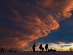 Dog walkers delighted at the change in weather conditions at Tom Campbell's hill in Calgary on Monday, January 10, 2022.