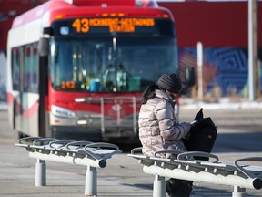 A public transportation user waits for a bus at the Chinook CTrain station on January 16, 2022.