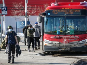 Transit users at the Chinook CTrain station bus loop were photographed on Sunday, January 16, 2022. Calgary Transit is reducing service starting Monday due to staff shortages brought on by the Omicron variant of COVID-19.