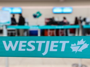 A WestJet check-in area at Calgary International Airport was photographed on Tuesday, January 18, 2022.  WestJet announced that it would consolidate or cancel up to 20% of its flights through February 28.