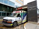 A ambulance sits stationary at the Foothills Medical Centre as the Alberta government launched a provincial emergency medical services advisory committee to address the situation in Calgary on Monday, January 24, 2022. 