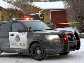 Calgary police investigate a fatal shooting in a back alley in the 1200 block of 17th Street S.W. in Calgary on Thursday, Jan. 6, 2022.