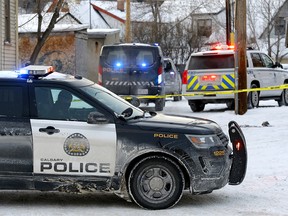 Calgary police investigate a fatal shooting in a back alley in the 1200 block of 17 St. S.W. in Calgary on Thursday, January 6, 2022.
