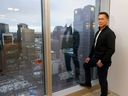 Greg Kwong, the Executive VP and Regional Manager of CBRE looks out over downtown from his office building on Wednesday, January 12, 2022.