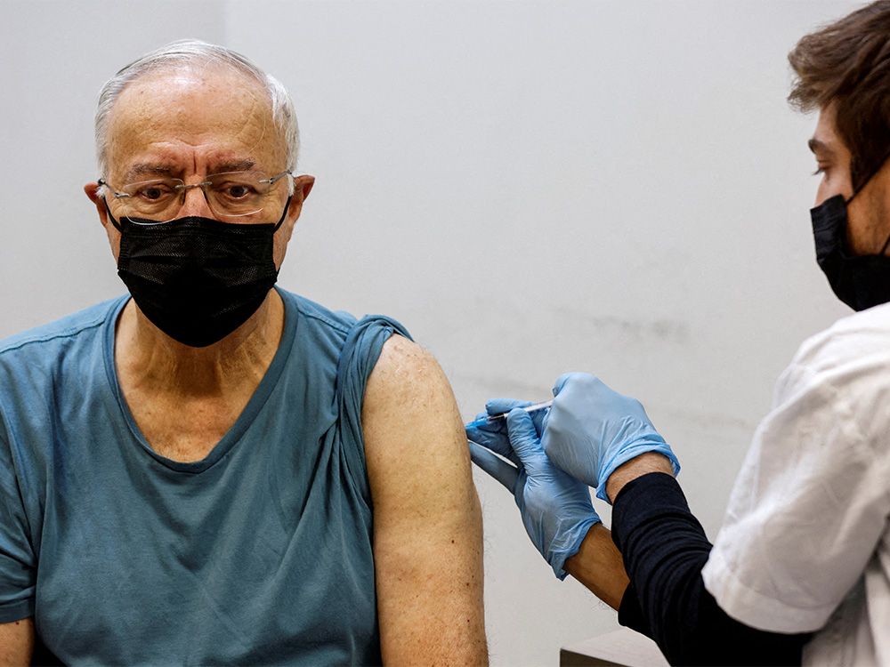  A man receives a fourth dose of COVID-19 vaccine in Tel Aviv, Israel, on Jan. 3, 2022.