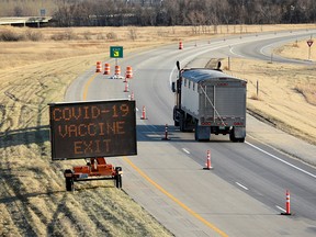 FILE PHOTO: Manitoba-based truckers, transporting goods to and from the United States, are being vaccinated against coronavirus disease (COVID-19) as part of a deal between the Canadian province and the state of North Dakota, at a rest stop near Drayton, North Dakota, U.S. April 22, 2021.
