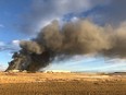 Smoke from a fire at Highline Mushrooms' facility north of Airdrie could be seen from Highway 2 on Sunday, Jan. 23, 2022.