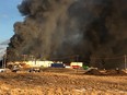Smoke from a fire at Highline Mushrooms' facility north of Airdrie could be seen from Highway 2 on Sunday, Jan. 23, 2022.