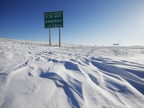 Road signage is photographed just outside of Emerson, Man. on Thursday, January 20, 2022. American investigators believe the deaths of four people, including a baby and a teen, whose bodies were found in Manitoba near the United States border are linked to a larger human smuggling operation.