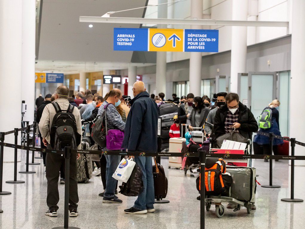  Travellers make their way to the COVID-19 testing area at Toronto Pearson International Airport Terminal 1.