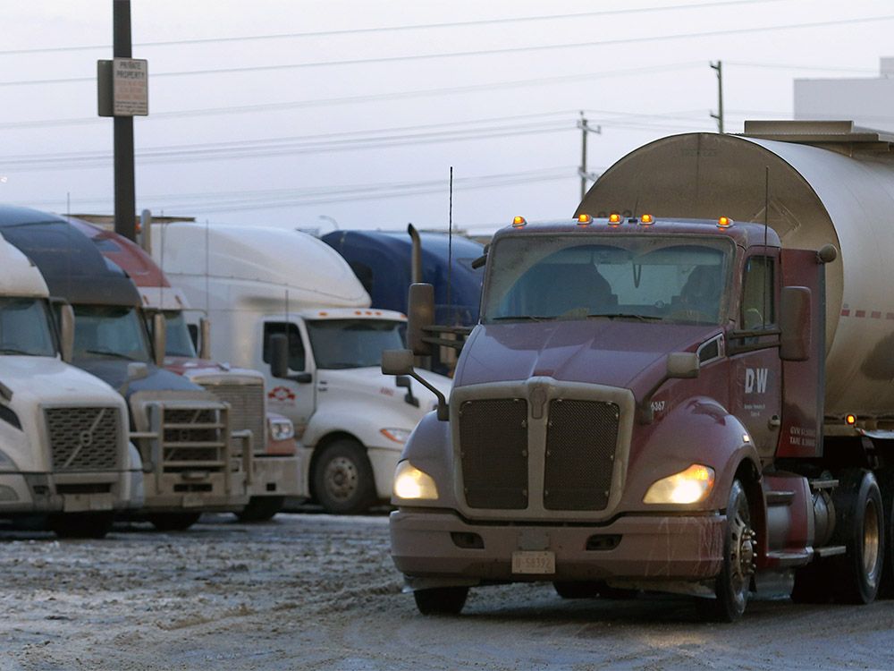  Transport trucks parked at the Roadking Travel Centre in Calgary as vaccine mandates at the U.S. border could worsen supply chains. Photo taken on Tuesday, January 11, 2022.