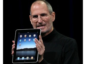 In 2010, Apple CEO Steve Jobs unveiled the iPad tablet computer during a presentation in San Francisco. Here, Jobs holds up the new iPad as he speaks during an Apple Special Event at Yerba Buena Center for the Arts January 27, 2010 in San Francisco, California. Apple was introducing its latest creation at the time, the iPad, a mobile tablet browsing device that is a cross between the iPhone and a MacBook laptop.