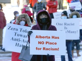 The Chinese community held a rally to demand Jason Kenney to make a public apologize about his Wuhan Bat Soup controversial comments at the McDougall Center in Calgary on Saturday, January 1, 2022. Darren Makowichuk/Postmedia