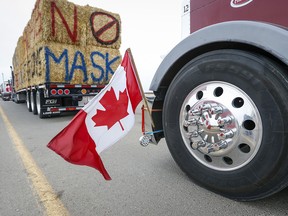 Truckers take part in an anti-mandate convoy blocking the busy U.S. border crossing in Coutts, Alta., on Monday, Jan. 31, 2022.