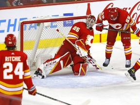 Calgary Flames goalie Jacob Markstrom and teammates react after a goal by the Ottawa Senators at Scotiabank Saddledome in Calgary on Thursday, Jan. 13, 2022.