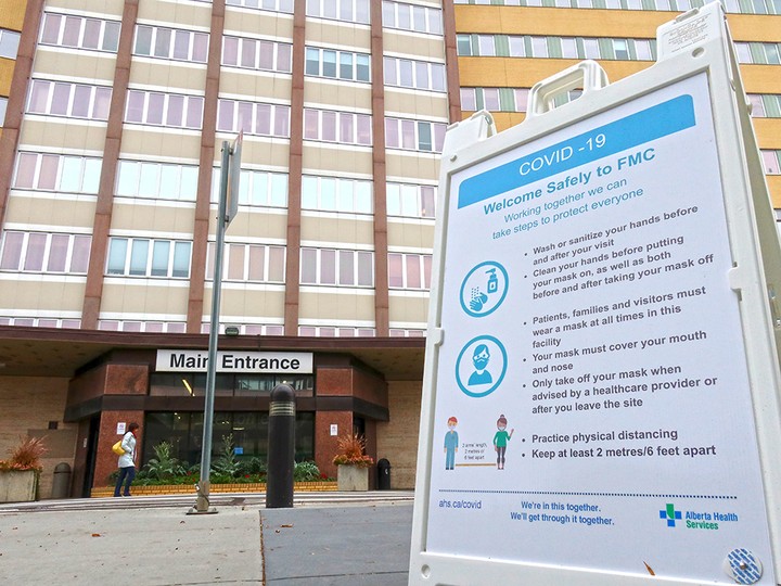  A COVID-19 information sign is seen outside the Foothills hospital in Calgary on Oct. 13, 2020.