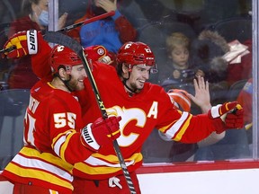 Flames centre Sean Monahan celebrates a third-period goal during Tuesday night's game against the Florida Panthers at the Scotiabank Saddledome.