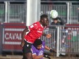 Cavalry FC Karifa Yao goes high over a Pacific FC defender during CPL semifinal action at ATCO Field at Spruce Meadows in Calgary on  Nov. 20, 2021.