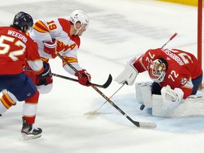 Florida Panthers goaltender Sergei Bobrovsky blocks the shot of Calgary Flames winger Matthew Tkachuk (19) at FLA Live Arena in Sunrise, Fla., on Jan. 4, 2022.