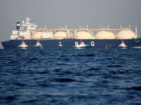 A liquefied natural gas tanker is tugged towards a thermal power station in Futtsu, east of Tokyo, Japan November 13, 2017.