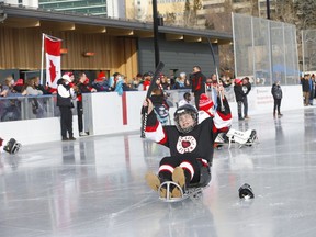 Sledge hockey players check out the ice as the Parkdale Community Association, in partnership with the Calgary Flames Foundation, Parks Foundation, Sledge Hockey Calgary, and City of Calgary and Government of Alberta, celebrated the opening of the first accessible outdoor rink in Alberta the Parkdale Community Rink in Calgary on Saturday, January 29, 2022.