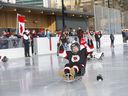 Sledge hockey players check out the ice as the Parkdale Community Association, in partnership with the Calgary Flames Foundation, Parks Foundation, Sledge Hockey Calgary, and City of Calgary and Government of Alberta, celebrated the opening of the first accessible outdoor rink in Alberta the Parkdale Community Rink in Calgary on Saturday, January 29, 2022. 