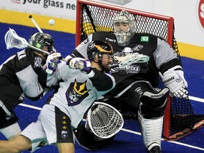 The San Diego Seals’ Wesley Berg scores on this backhand shot against Calgary Roughnecks goalkeeper Christian Del Bianco on WestJet Floor at Scotiabank Saddledome in Calgary on Dec. 17, 2021.