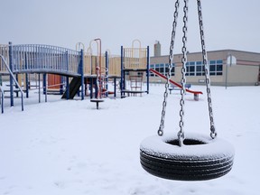A snow-covered playground at Mount View School in northeastern Calgary.  The Christmas holidays have been extended to January 10, as COVID-19 cases rise in Alberta.