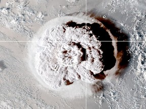 The eruption of an underwater volcano off Tonga, which triggered a tsunami warning for several South Pacific island nations, is seen in an image from the NOAA GOES-West satellite taken at 05:00 GMT January 15, 2022.