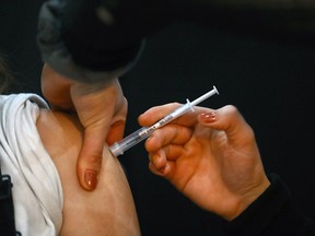 FILE PHOTO: Nurse Rachelle Lively was giving out COVID shots as part of the City of Calgary’s extension of its mobile vaccination outreach program, a short-term COVID-19 vaccination station launched at Southcentre Mall on Monday, January 3, 2022.