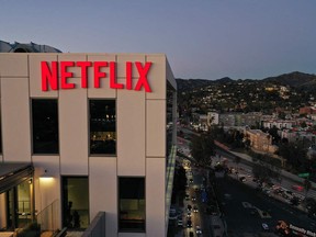 The Netflix logo is seen on top of their office building in Hollywood, California, January 20, 2022. The streaming service ended the year with 221.8 million subscribers, just below target, after booming during coronavirus lockdowns that kept people at home and on the platform. (Photo by Robyn Beck / AFP) (Photo by ROBYN BECK/AFP via Getty Images)
