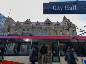 A CTrain passes the City Hall LRT station in downtown Calgary on Thursday, February 3, 2022.