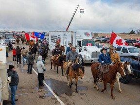 Around 100 riders show their support for protesters at a roadblock on southbound Highway 4 south of Milk River, Ab., on Saturday February 5, 2022.