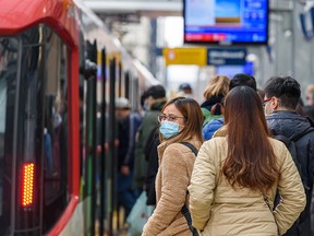 Calgarians are asked to continue wearing a mask while using public transit as most COVID-19 restrictions are lifted on March 1, 2022.