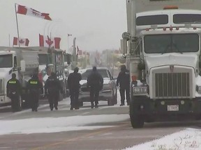CTV screengrab of RCMP at the Coutts blockade of truckers and others protesting COVID-19 measures at Alberta's southern border crossing.