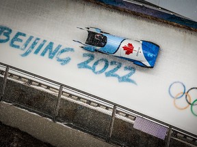 Canada’s Christine de Bruin slides during a heat of the women’s monobob at the Yanquing National Sliding Centre during the Beijing 2022 Winter Olympics on Sunday, February 13, 2022.