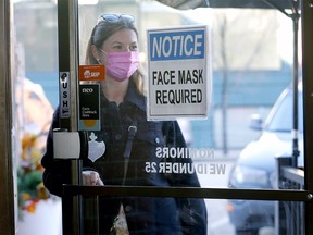 Patron Madison enters Side Street Pub and Grill in Kensington. Some COVID restrictions could be dropped in Calgary. Photograph taken on Monday, February 7, 2022.