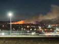 Fire crews are responding to a grass fire at Nose Hill Park on Saturday. Flames and smoke could be seen from the Calgary airport.