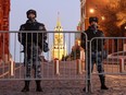 Soldiers from the Russian National Guard prepare to patrol the area surrounding Saint Basil's Cathedral on Red square in Moscow, Russia, on Thursday, Feb. 24, 2022.