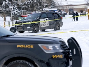 Calgary police investigate a shooting between two vehicles in a back alley on 11ave. and 44 str. S.E. in Calgary on Monday, February 21, 2022. Darren Makowichuk/Postmedia