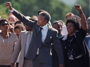 On this day in history — February 11, 1990 — anti-apartheid leader and African National Congress (ANC) member Nelson Mandela (C, L) and his then wife Winnie Madikizela-Mandela raised fists upon Mandela's release from  prison in South Africa.