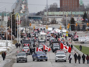 Protesters and supporters set up at a blockade at the foot of the Ambassador Bridge, sealing off the flow of traffic over the bridge into Canada from Detroit, on Feb. 10, 2022 in Windsor.
