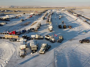 A truck convoy blocks the U.S. border crossing at Coutts on Feb. 2, 2022.