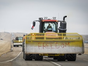 Demonstrators leave in a convoy after ending their blockade at Coutts on Tuesday.
