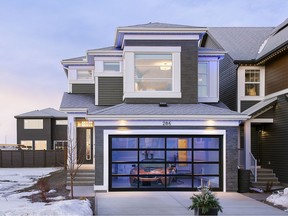 The net-zero Madeline show home by Jayman Built in Seton includes an electric vehicle charging station in the garage.