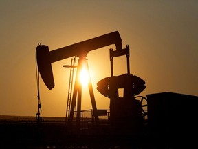 An pumpjack extracts oil in a field near Calgary.