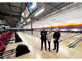 Matthew Evans, from left, director of business development for  Atlas Development Corp, Ania Gryzewski, associate vice-president of CBRE Commercial Real Estate, and David Kist, partner in YYC Bowling, Let's Bowl and Mountain View Bowl, at the bowling and casino building on 42nd Avenue S.E. that has been purchased by Atlas Development.